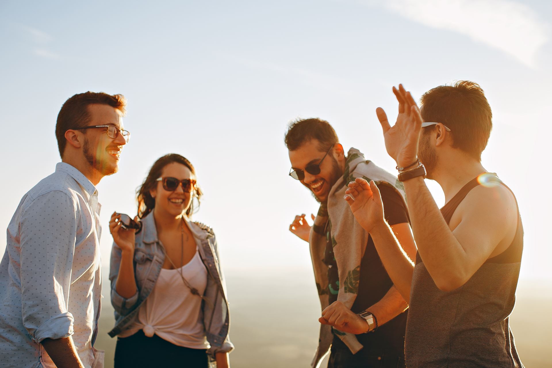 a group of people standing around each other